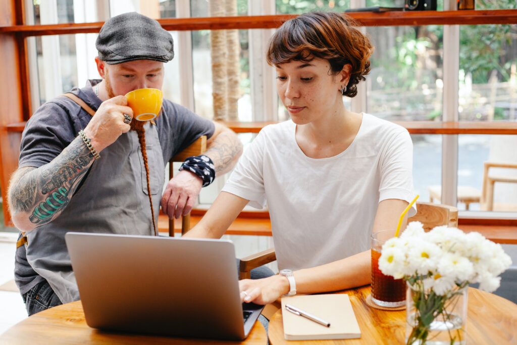 small-business-owners-working-computer Two small business owners looking at something on a computer.